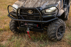 The front of a camouflage Kubota RTV-X utility vehicle: its brush guard and winch, close up