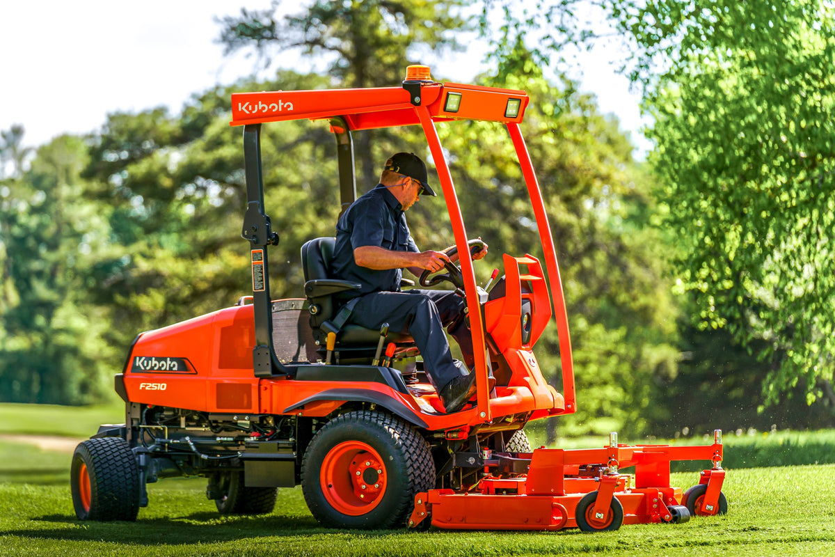 Kubota F2510 front-mount mower with a sun canopy, mowing