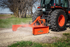 Land Pride GS15 series grading scraper on a Land Pride QH16 quick hitch, grading gravel behind a Kubota tractor, close up