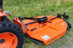 The deck and gearbox of a Land Pride RCR1884 rotary cutter on a Kubota tractor, close up