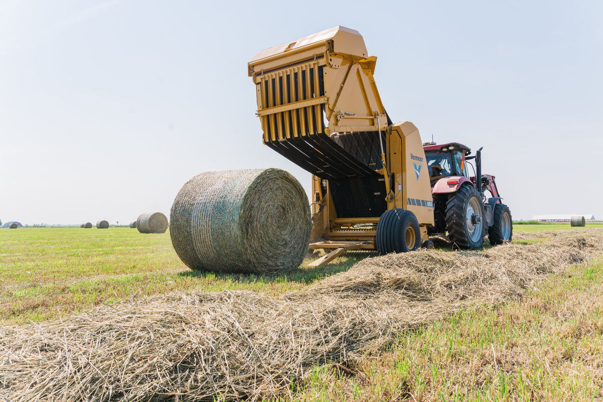 Vermeer 605S Rancher round baler ejecting a bale