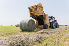 Vermeer 605S Rancher round baler ejecting a bale