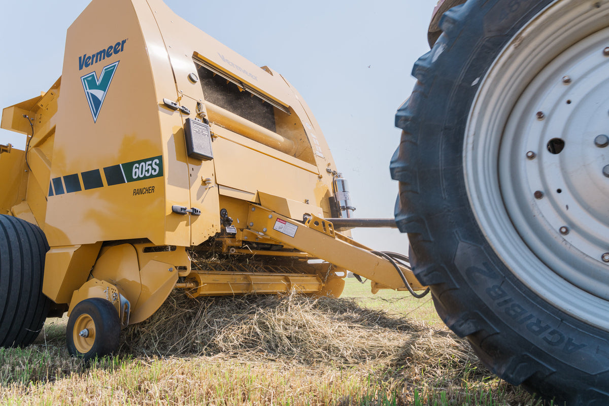 Vermeer 605S Rancher round baler front close-up while baling hay