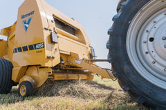 Vermeer 605S Rancher round baler front close-up while baling hay