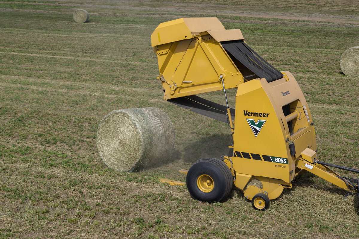 Vermeer 605S Signature round baler ejecting a bale