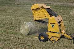 Vermeer 605S Signature round baler ejecting a bale