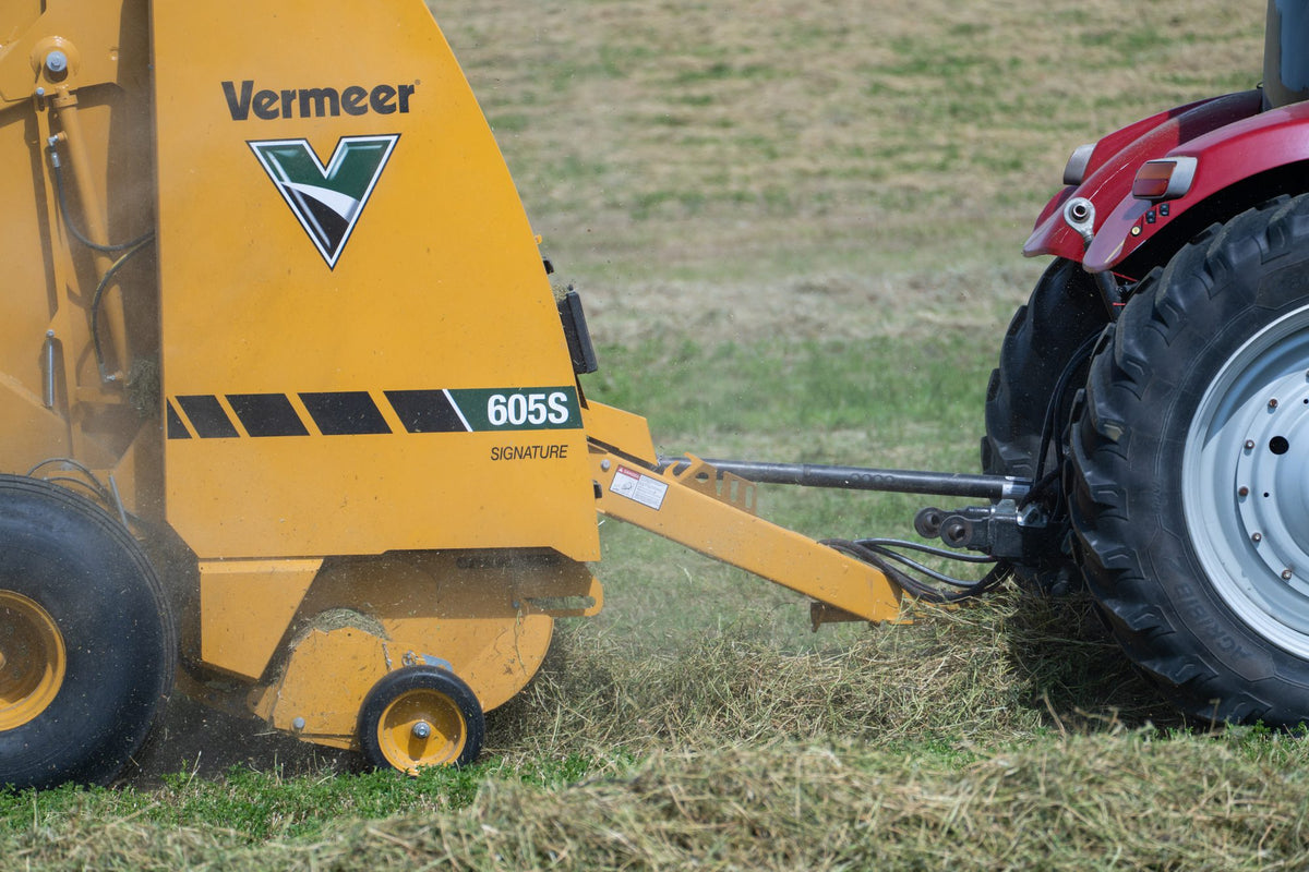 Vermeer 605S Signature round baler close-up while baling