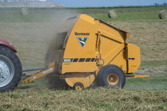 Vermeer 605S Signature round baler working in a hay field