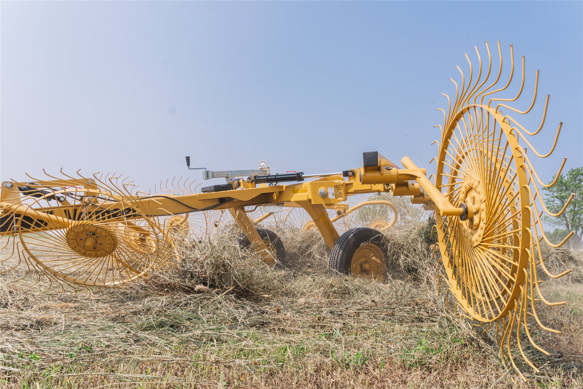 Vermeer VRC1022 carted wheel rake raking hay in a field