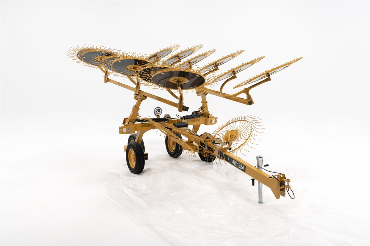 Vermeer VRC1224 carted wheel rake on a white background with its toolbars lifted