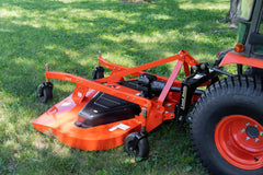 Land Pride FDR25 series grooming mower behind a Kubota compact tractor on grass, close up
